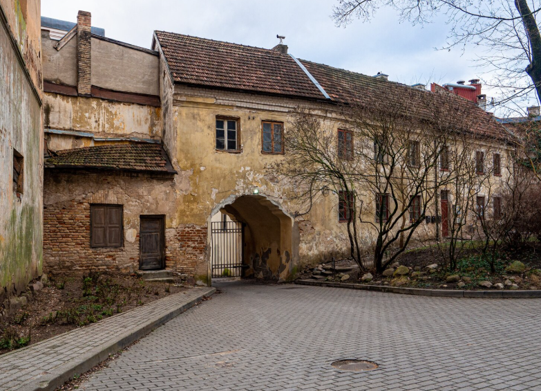 Aging historic building on a quiet street showing hidden historical landmarks hiding in plain sight
