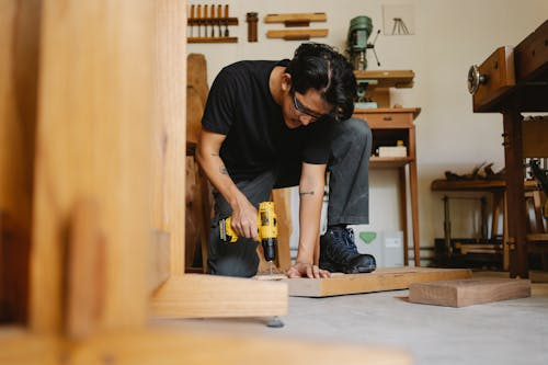 Man building a wooden project, an example of creative passion projects made in spare time