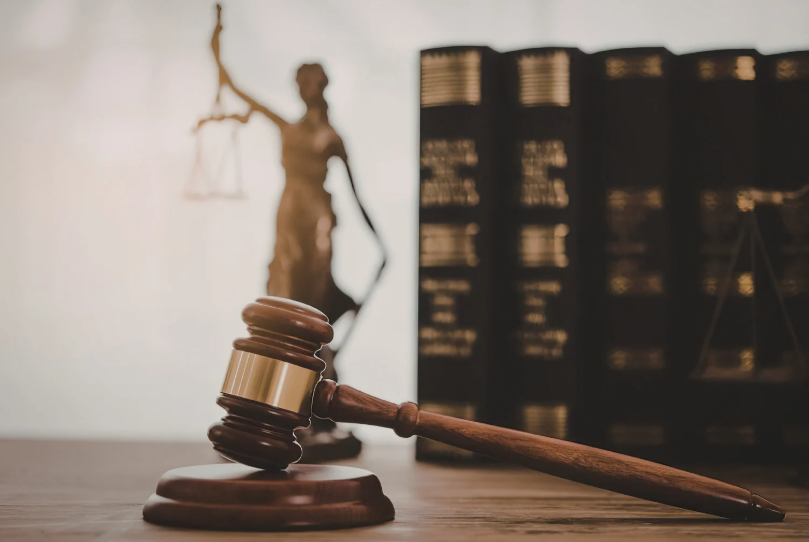 Gavel, law books, and justice statue illustrating strange laws in history and legal change