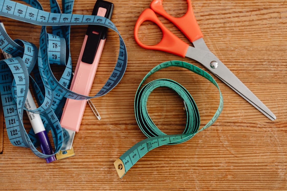 Scissors and measuring tapes showing everyday objects that haven’t changed much over time