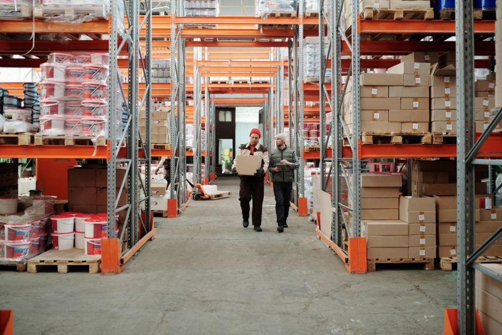 Warehouse workers handling packages showing how everyday services work behind the scenes
