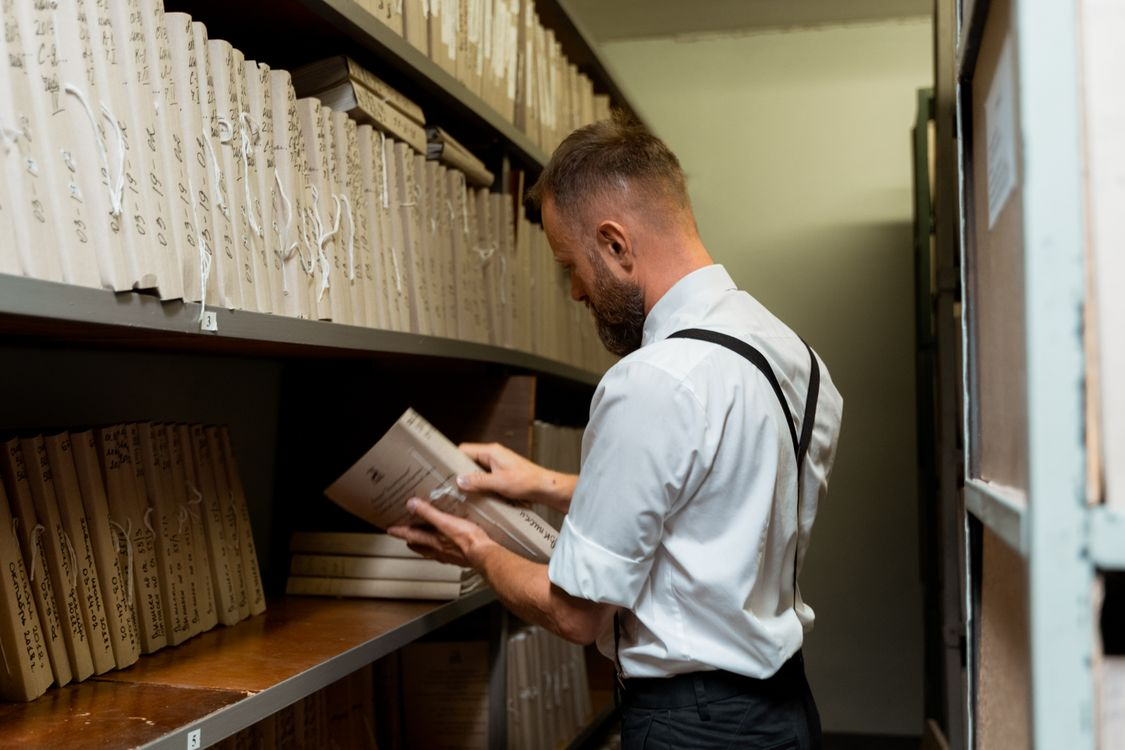 Archivist reviewing stored records illustrating unusual careers you never knew existed