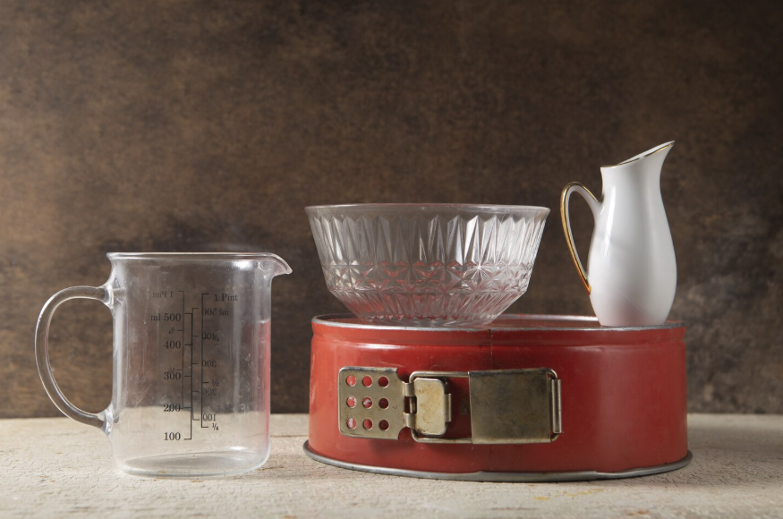 Vintage kitchen tools and measuring cup showing the history of common household items used in daily life
