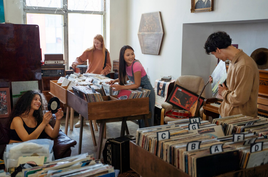 People browsing vintage records and nostalgic items showing why trends come back over time